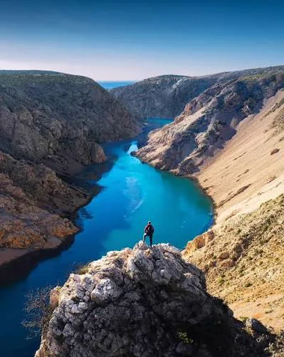 Turquoise Zrmanja river cutting through a stone canyon
