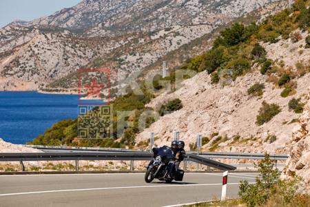 Harley-Davidson on the D8 coastal road below Velebit near Karlobag